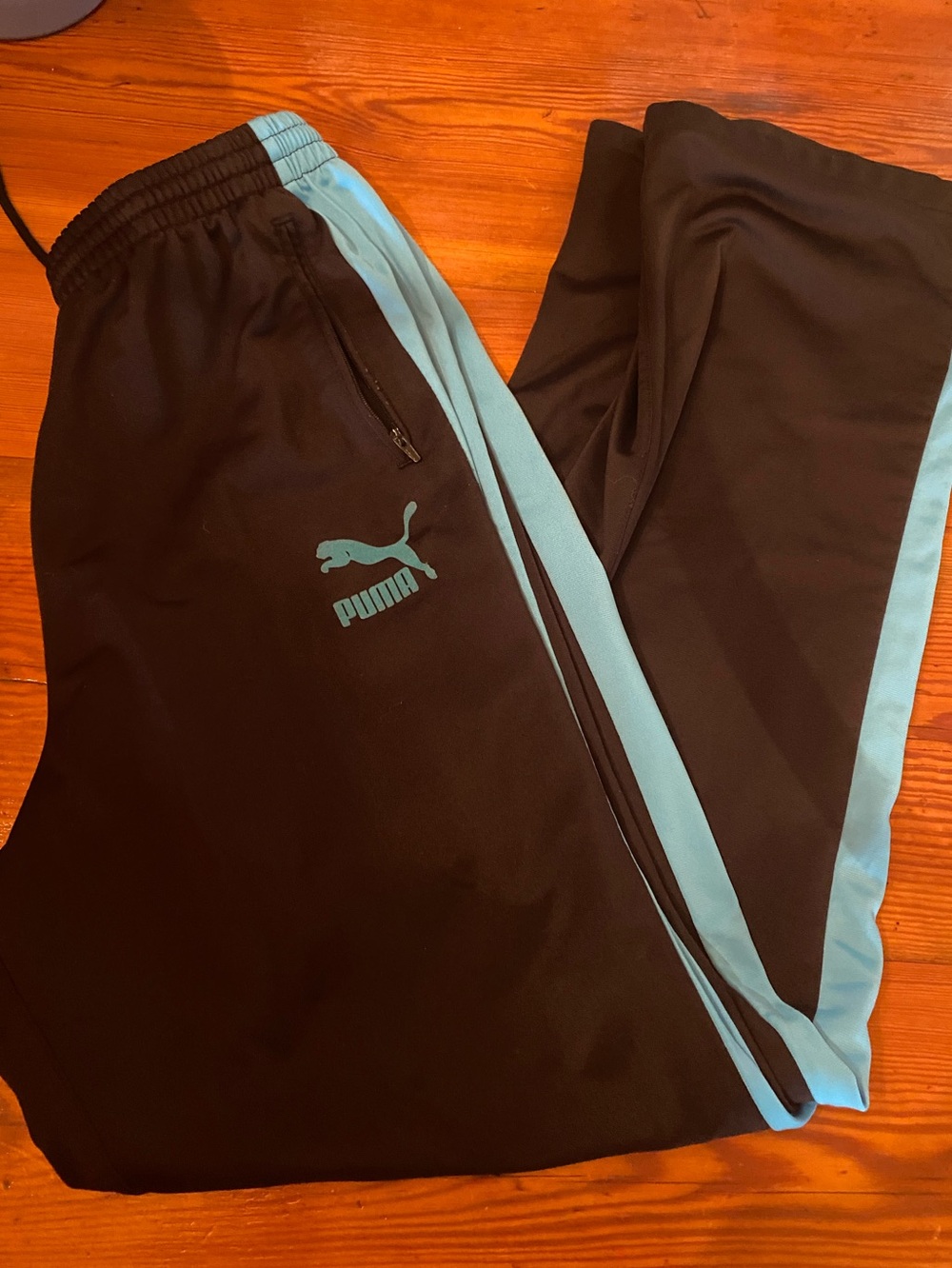 Puma men’s medium Track Pants with Light Blue Stripe